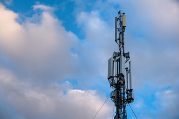 Cellular antenna. Mobile phone communication tower with blue sky