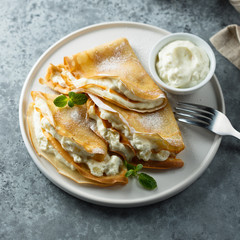 Crepes stuffed with cottage cheese cream