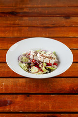 Fresh greek salad with feta on the table