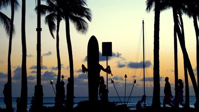 Time lapse video of tourists walking at sunset in Waikiki beach in 4k 