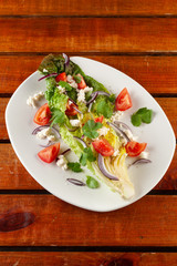 Summer vegetable salad with tomatoes and greens