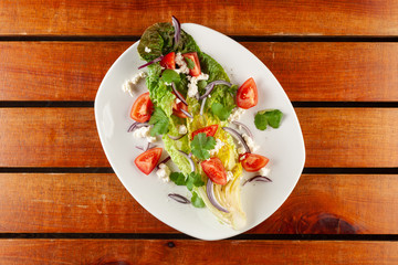 Summer vegetable salad with tomatoes and greens