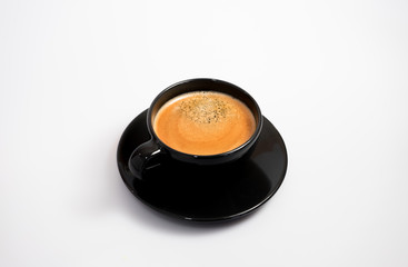 Isolated espresso coffee in modern black cup 