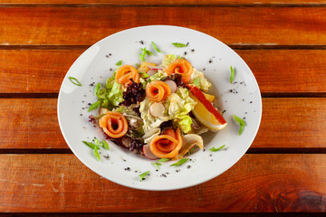 Salad with slices of smoked salmon