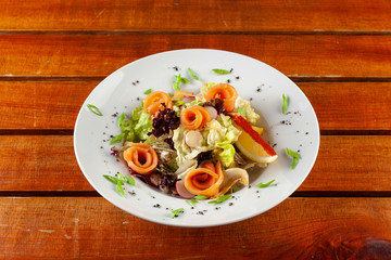 Salad with slices of smoked salmon