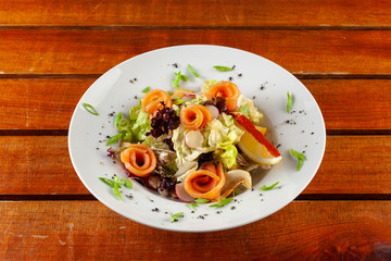 Salad with slices of smoked salmon