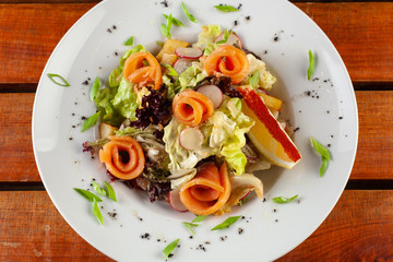 Salad with slices of smoked salmon