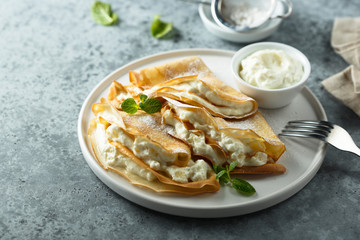 Crepes stuffed with cottage cheese cream