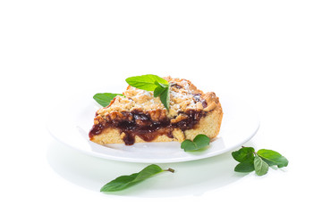 sweet cake with fruit jam in a plate on a white