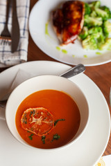 Two-course set meal with a close-up spicy tomato soup view