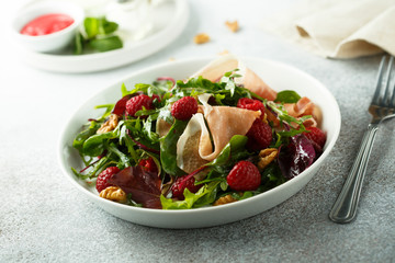 Prosciutto salad with walnuts and fresh raspberries