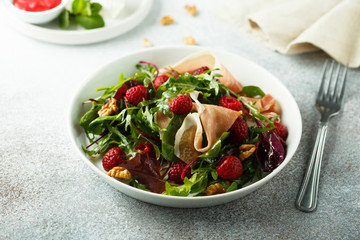 Prosciutto salad with walnuts and fresh raspberries