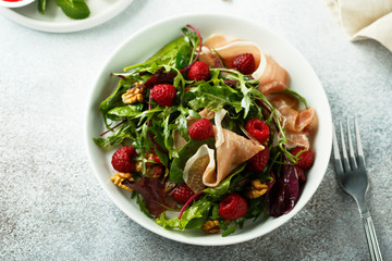 Prosciutto salad with walnuts and fresh raspberries