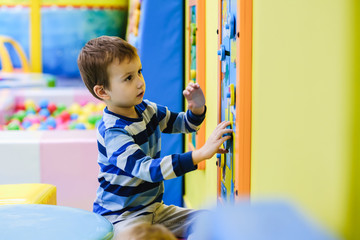 Playground in indoor amusement park, children.