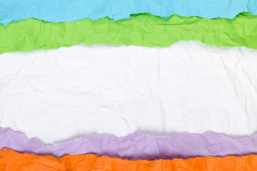 Background of strips of colored crumpled paper