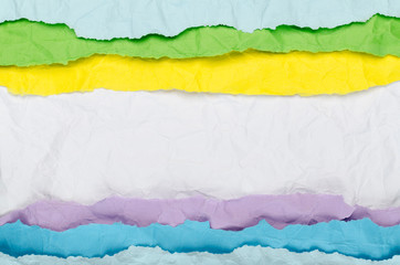 Background of horizontal strips of multi-colored crumpled paper