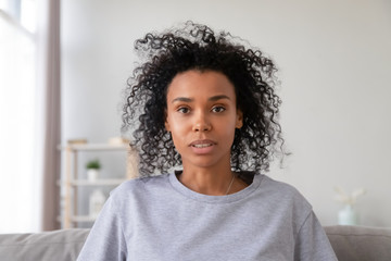 Head shot portrait of African American woman making video call