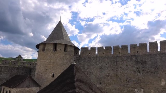 The tower inside the fortress and the high stone wall in Hotin Ukraine