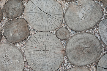 Wooden pavement made from rounded pieces of wood. 