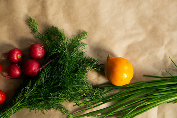 Naklejka na ściany i meble Healthy food background. Assortment of fresh vegetables on paper background