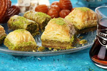 Middle eastern or arabic dishes. Turkish Dessert Baklava with pistachio on dishes