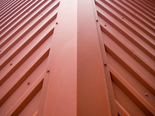 Obraz premium Fragment of the roof of a building covered with a metal gofrolist