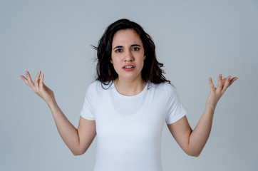 Portrait of beautiful young latin woman with angry and furious face. Human expressions and emotions