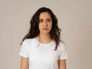 Fototapeta premium Portrait of sad and depressed woman. Isolated on neutral background. Human expressions and emotions