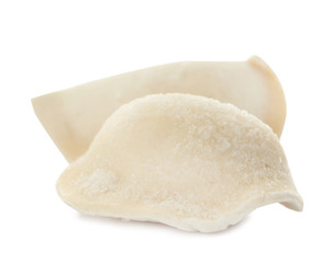 Raw dumplings with tasty filling on white background