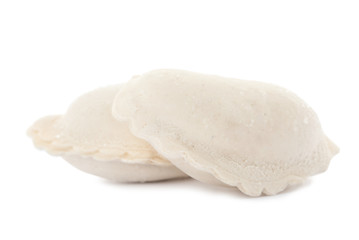 Raw dumplings with tasty filling on white background