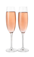 Glasses of rose champagne isolated on white