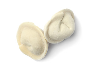 Frozen raw dumplings on white background, top view. Traditional dish