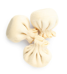 Frozen raw dumplings on white background, top view