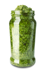 Jar of tasty pesto sauce isolated on white