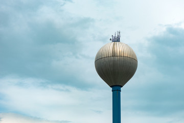 Water tower against overcast sky