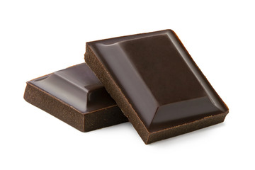Two squares of dark chocolate isolated on white.