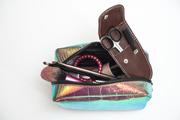 Manicure scissors in a leather brown case. Cosmetic bag, wallet pedicure accessories. Fashionable...