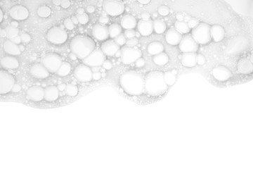Soft soap foam on white background, top view