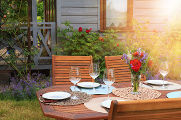 Image of a romantic table setting, for a wedding or garden party.