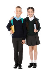 Full length portrait of cute children in school uniform on white background