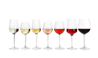 Row of glasses with different wines on white background