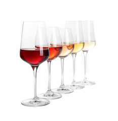 Row of glasses with different wines on white background