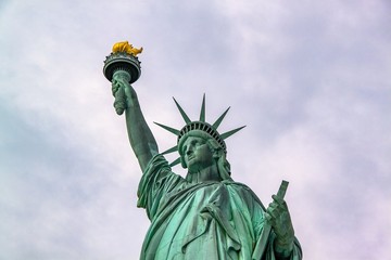 Fototapeta na wymiar Nice view on isolated Statue of Liberty New York. Beautiful backgrounds.