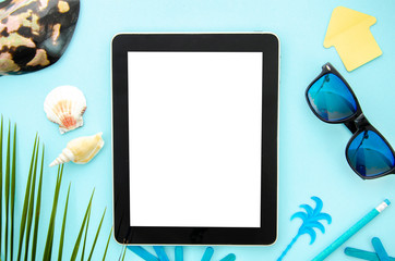 Top view mockup summer work desk. Tablet pc for responsive design with seashell, sunglasses and palm leaf
