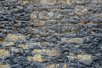 The old wall of stone blocks