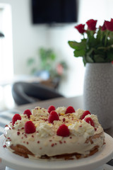 Cake with white cream and strawberry on the top 