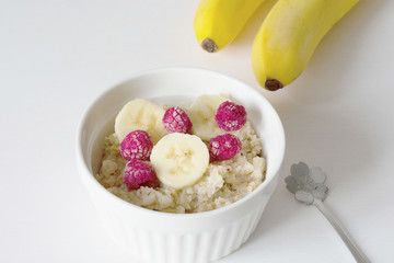 A bowl of oatmeal on a white background. Healthy breakfast