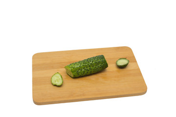 Sliced cucumber on a wooden board, Sliced cucumber on a wooden board
