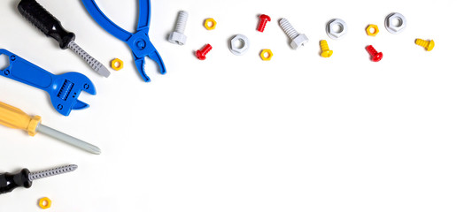 Toys background. Kids toy tools for education on white. Top view.