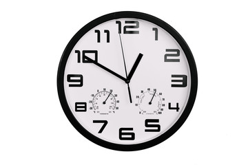 simple classic black and white round wall clock isolated on white. Clock with arabic numerals on wall shows 12:50 , 00:50